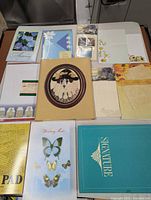 Overview of all unopened stationery items on table