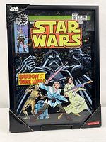 Full view of framed 3D comic wall art with protective corner guards