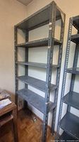 Full view of gray galvanized steel rack with five shelves