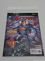 Front view of bagged Action Comics #13 comic
