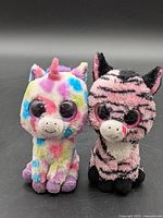 Front view of Wishful and Zoey plush toys