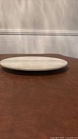 Side profile of marble platter on table