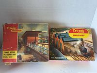 Front of both original boxes showing titles and artwork
