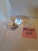 Oblique view of faceted clear crystal paperweight