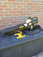 Complete Yardworks blower/vacuum with bag and yellow mount