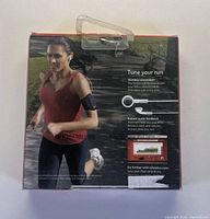 Front of boxed Nike + iPod Sport Kit showing running graphic and feature text