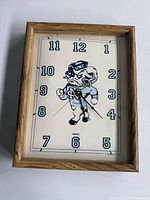 Front view of UNC mascot clock showing dial and frame