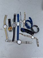Group shot of all ten wristwatches laid out
