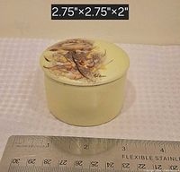 Trinket box with lid on, ruler shows scale