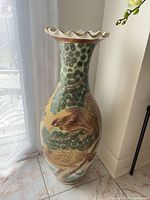 Full view of tall Satsuma vase showing hand-painted birds and foliage