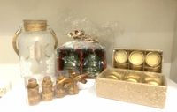 All items in lot: frosted jar with rope handle, LED lights, two shrink-wrapped boxes of gold votives, four mini decorative bottles