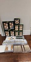 Full lot showing boxed ornaments, tray of spiral ornaments, open box with finial and string lights
