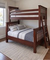 Bunk bed fully assembled showing twin top, full bottom, ladder attached