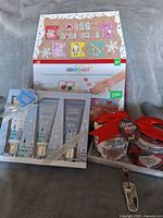 Group shot of all three sealed holiday gift items