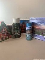 Group view of all seven puzzles showing various box and canister styles