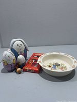 Group shot of bowl, boxed cutlery and nesting bunnies