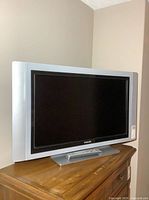 Front view of Philips 32" TV on stand