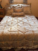 Full view of made bed with comforter and pillows