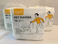Front view three packages Casoft PET DIAPERS size L