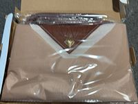 Tote bag sealed in plastic inside original box