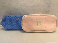 Blue quilted "Sylane" and pink "Special" pencil cases front view