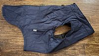 Front view of navy blue dog vest jacket showing zipper and collar