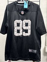 Front view of black Raiders #89 jersey