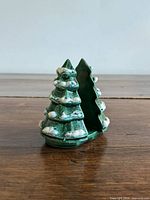 front angled view of ceramic snow-tipped tree holder