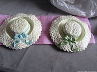 Both Sylvac ceramic wall pocket hats side by side