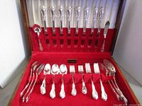 Open chest showing full flatware set