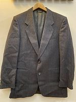 Front view of navy wool sports coat on hanger