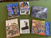 All six books laid out showing front covers