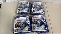 Four sealed Dudley Player duffel bags laid out