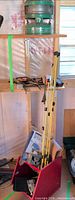 Full lot view with heater on shelf, poles, Aerocart kit in red bin