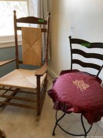 Wood rocking chair and metal chair side-by-side