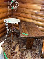 All three items grouped: wood side table, marble-top accent table, wire rack
