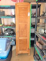 Front view of wooden cabinet closed