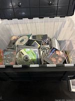 Open tote showing numerous CDs