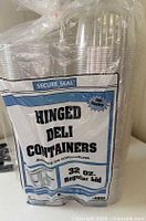 Front of sealed package showing Secure Seal branding and container stack
