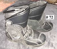 Side view of both boots showing buckle, panels, and general wear