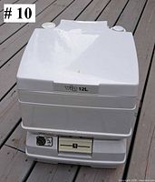 Closed toilet showing vip 12L label and overall exterior