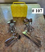 overall lot view with four utensil stacks and egg carrier closed