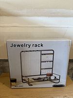Front view of boxed jewelry organizer showing product image and model MZY-506C
