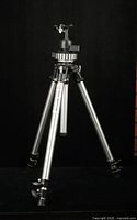 Tripod fully extended showing legs and ball head