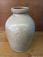 Full view of stoneware crock showing overall form and glaze