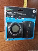 Front of sealed package showing GE SunSmart wireless timer system components