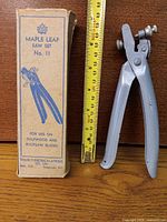 Tool next to original box and tape measure