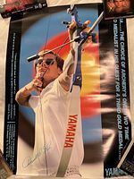Full view of poster showing athlete, Yamaha branding, autograph