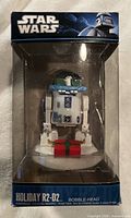 Front view of sealed Funko Star Wars Holiday R2-D2 bobble-head in box