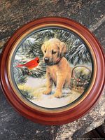 Front view of framed plate showing puppy and cardinal artwork
